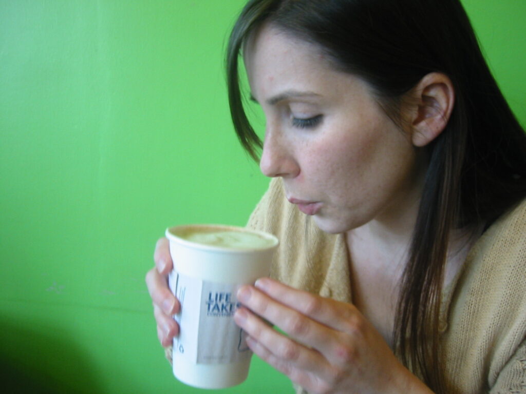 Jen Likes Coffee Cold June Bug Café drinking a latte
