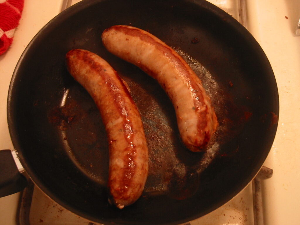 Frying sausages because pork